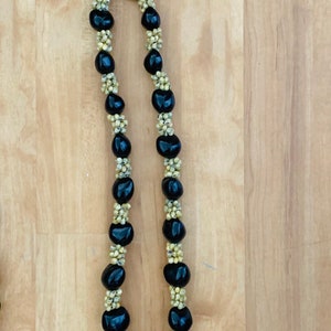 Hawaii Black Kukui Nut Lei With Natural Color Shells