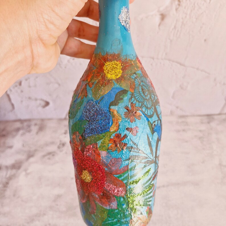 Upcyled wine bottle painted in turquoise  and decoupaged with exotic flowers