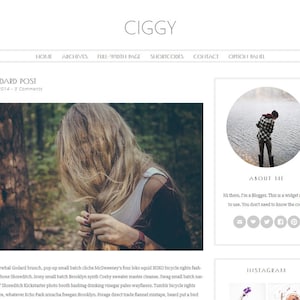 May include: A woman with long blonde hair is standing in a forest. She is wearing a white tank top and a dark green jacket. The image is a close-up of her face and hair.