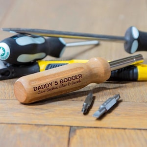 May include: A wooden screwdriver with a personalised message that reads "Daddy's Bodger Love Sophia, Elise & Jacob".