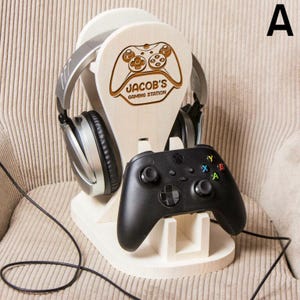 May include: A wooden gaming station with a controller holder and headphone stand. The station is engraved with a video game controller and the text "Jacob's Gaming Station".