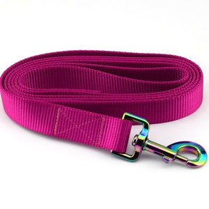 May include: A pink nylon dog lead with a rainbow iridescent metal clip.