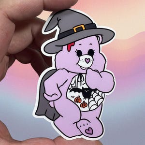 Spooky Halloween Care Bear Glossy Vinyl Water Resistant Sticker | High-Quality Art Purple Bleeding Bat Cobwebs Pumpkin Cape Spook Cute