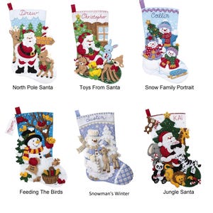 May include: Six decorative Christmas stockings featuring embroidered names and festive appliqués including Santa Claus, snowmen, reindeer, and jungle animals. Each stocking displays unique holiday scenes with colourful felt details and hanging loops.