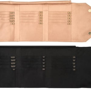 May include: A black and a beige fabric roll-up case with multiple slots for storing jewelry. The case has a flap that closes with a snap.