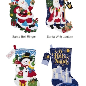 May include: Four felt Christmas stockings with different designs. The first stocking is blue with a Santa Claus holding a bell and the name "Liam" on it. The second stocking is blue with a Santa Claus holding a lantern and the name "Jake" on it. The third stocking is blue with a snowman holding a girl and the name "Kayla" on it. The fourth stocking is blue with a white cityscape and the words "O Holy Night" on it.