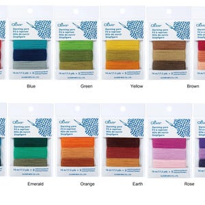 May include: A set of 16 skeins of embroidery floss in various colours, including beige, red, blue, green, yellow, brown, pink, grey, rouge, lake, emerald, orange, earth, rose, purple, and denim. Each skein is labelled with the colour name and the brand "Oliver".