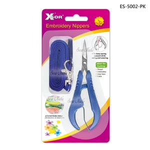 May include: Blue embroidery nippers with a curved blade design and a blue lanyard. The packaging includes the text "Sew Mate" and "XOR Embroidery Nippers".