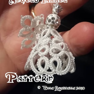 May include: White crocheted angel ornament with a silver and white bead. The ornament is labeled "Angelo Yamhel Pattern © Edna Guastalla 2018".