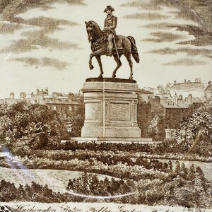 May include: A black and white engraving of a statue of George Washington on horseback in the Public Garden in Boston, Massachusetts. The statue is on a pedestal and surrounded by trees and bushes. The text "Washington Statue. Public Garden. Boston." is at the bottom of the image.