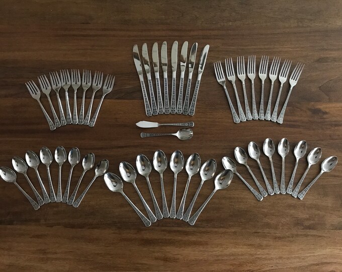 Mid Century Interpur Fleur De Lis and Flower Handle Stainless Flatware