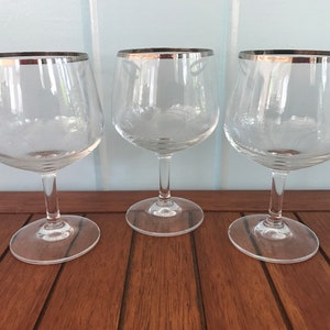 Three Crystal Glasses with Silver Rim