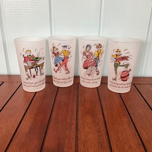 May include: Set of four white frosted glass tumblers with colorful illustrations of people dancing and playing music. Each glass has a different illustration and a short rhyme about dancing.