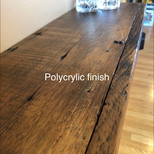 May include: A close-up of a wooden shelf with a polycrylic finish. The shelf is made of reclaimed wood and has a rustic look.