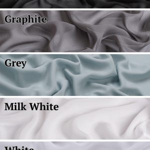 May include: A vertical collage of five fabric swatches in varying colours, each labelled with text. The colours include black, graphite, grey, milk white, and white. Each section displays a soft, draped textile with a smooth, semi-sheer appearance.