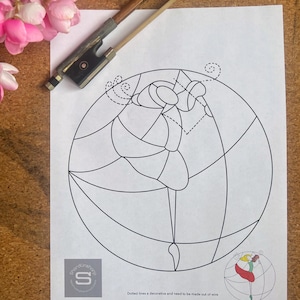 May include: A black and white line drawing of a ballerina in a circle. The ballerina is in a pose with one leg extended. The drawing is on a white sheet of paper. Dotted lines indicate where wire should be added for a decorative touch.