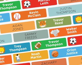 May include: A collection of rectangular name labels in various colors, each with a name and a small graphic. The labels feature names like Trevor Thompson and Marcus Leith, with images of a soccer ball, baseball, and a lion.