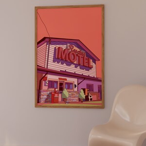 May include: Framed art print featuring a stylized illustration of a motel. The artwork showcases a building with a red and purple neon sign that reads "Rosabel Motel". The color palette includes shades of pink, purple, and brown, with a solid orange background.