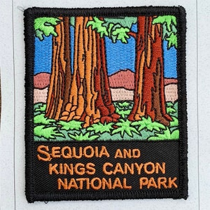 May include: A black and orange embroidered patch with a depiction of three large trees and the text "Sequoia and Kings Canyon National Park".