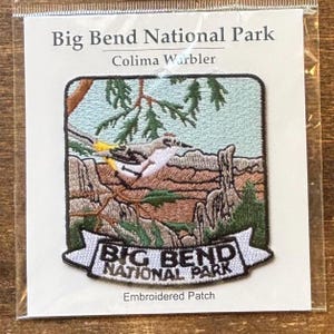 May include: Embroidered patch featuring a Colima Warbler perched on a branch, set against a backdrop of Big Bend National Park scenery. The patch includes the text "Big Bend National Park" on a white banner.