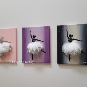 May include: Three canvas paintings of a ballerina silhouette with a white feather tutu. The ballerina is painted on a pink, purple, and black background with silver glitter accents.