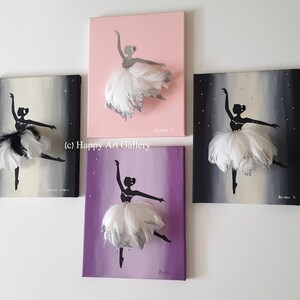May include: Four canvas paintings of a ballerina silhouette with a white feather tutu. The ballerinas are on different colored backgrounds: pink, gray, purple, and black. The text "(c) Happy Art Gallery" is visible in the image.
