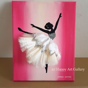 May include: A pink and white ombre canvas painting of a ballerina silhouette with a white tulle tutu. The tutu is textured and has glitter accents. The painting is signed "(c) Happy Art Gallery" and "Dipsree Samanta".