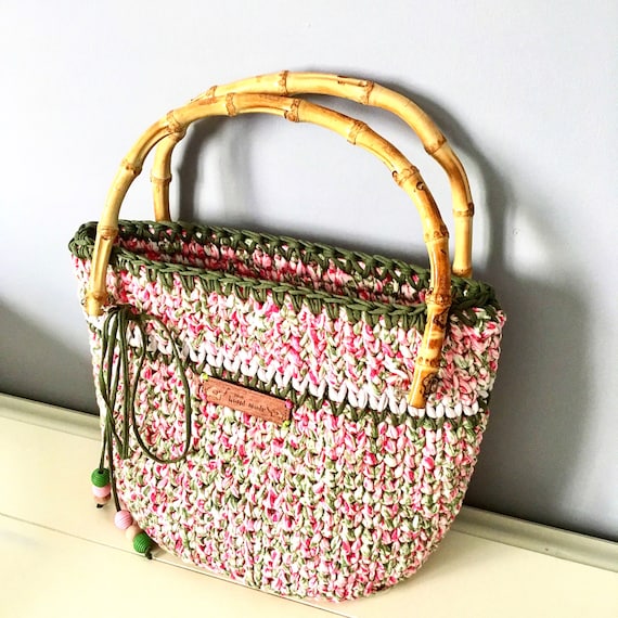 Crochet handbag made from cotton floral thead with wooden handles