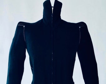 THIERRY MUGLER 1970 A black pointy shoulder zip up dress with razor precision on the sleeve. made in France