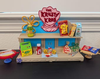 Estante de exhibición de Bob Esponja de Krusty Krab para la serie Miniverse Make It Mini Bob Esponja