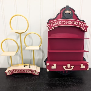 May include: Two decorative shelves, one shaped like a train with "Back to Hogwarts" text, and the other with three shelves and a "Quidditch" banner. The train shelf is burgundy with black accents, and the other is yellow and beige.