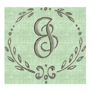 May include: A gray embroidered monogram letter "S" in a circular wreath with leaves and dots on a light green background.