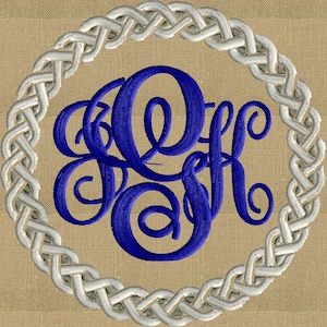 May include: A blue embroidered monogram in a white Celtic knot circle on a beige background.