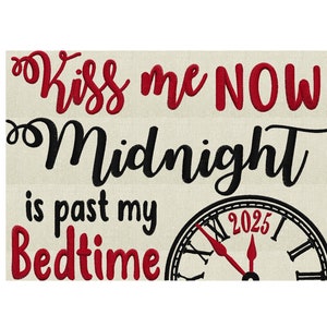 May include: Red and black embroidery design with the text "Kiss me NOW! Midnight is past my Bedtime" and a clock face with the year 2025.