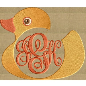 May include: A yellow rubber duck with a red beak and orange eyes. The duck has a monogram of the letters "K.F." in the center.