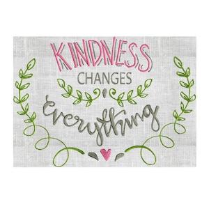 May include: Embroidered design on a linen background with green leaves and a pink heart. The text reads "Kindness Changes Everything".