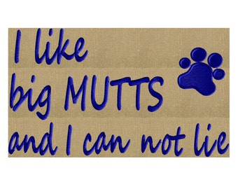 May include: A brown burlap background with blue embroidered text that reads "I like big MUTTS and I can not lie" with a blue paw print to the right of the text.
