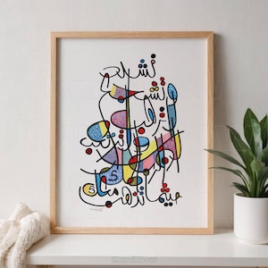 May include: A framed print of colorful abstract Arabic calligraphy in a wooden frame. The calligraphy is in a variety of colors, including red, blue, yellow, and green. The background is white.