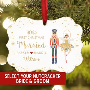 May include: A white Christmas ornament with a red ribbon, featuring a nutcracker and ballerina illustration. The ornament reads "2025 First Christmas Married" with names and "Select Your Nutcracker Bride & Groom" in a red banner.