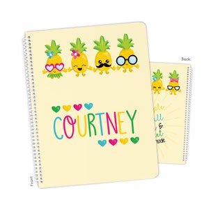 May include: A yellow spiral notebook with a front cover featuring a row of five cartoon pineapples with different expressions. The name "COURTNEY" is written in colorful letters below the pineapples. The back cover features two pineapples with sunglasses and the text "Simply Small & Sweet Inside".