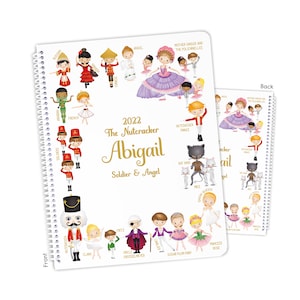May include: A spiral-bound notebook featuring a colorful illustration of characters from The Nutcracker ballet. The cover includes the title "2022 The Nutcracker Abigail Soldier & Angel" and various character names.