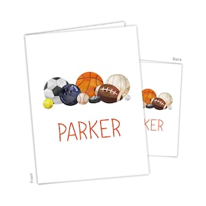 May include: A white card with a watercolor illustration of various sports balls, including a basketball, football, baseball, and soccer ball. The text "PARKER" is printed in orange below the illustration.