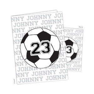 May include: Black and white soccer ball with the number 23 printed on it. The ball is surrounded by the repeated text "Johnny" in a gray font.