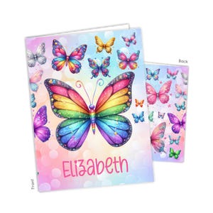 May include: A notebook and matching cover featuring a colorful butterfly design. The front cover displays a large rainbow-colored butterfly with the name "Elizabeth" below it. Additional butterflies in various colors and sizes are scattered across the cover.