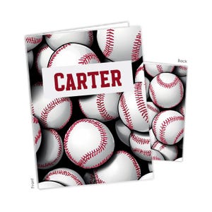 May include: A rectangular notebook featuring a repeating pattern of white baseballs with red stitching on a black background. A white horizontal rectangular label across the center displays the name CARTER in bold, dark red, capital letters.