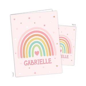 May include: A pink card with a rainbow design and the name Gabrielle. The back of the card has a smaller rainbow design and the word "Elle".