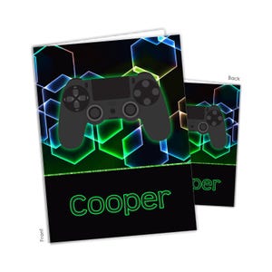 May include: A black and green birthday card with a neon green gamer controller on the front and the name "Cooper" in neon green letters. The back of the card has a black and green gamer controller on a black background.
