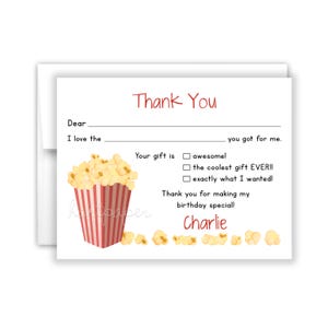 May include: A thank you card with a popcorn bucket and popcorn kernels. The card has a fill-in-the-blank section for the recipient's name and a section for the gift giver to write about the gift. The card also has a section for the recipient to check off a box to indicate how much they liked the gift. The card is signed "Charlie".