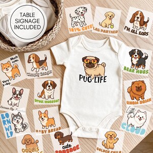 May include: A white baby bodysuit featuring a cartoon pug wearing sunglasses with the text PUG LIFE, surrounded by various square cards displaying illustrated dog breeds and phrases like 101% CUTE, SIMPLY BEAGLE, BEAR HUGS, and TABLE SIGNAGE INCLUDED.