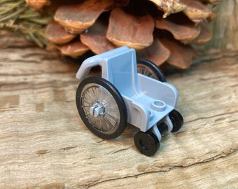 Wheelchair with Trans-Clear Wheelchair Wheels and Black Trolley Wheels - Genuine LEGO® Accessory